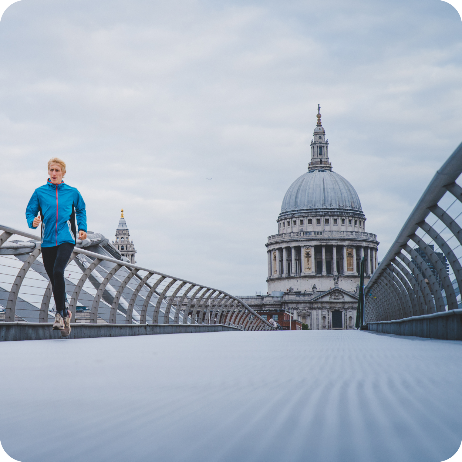 Man jogging on Millennium Bridge in London, promoting hydration and electrolyte balance