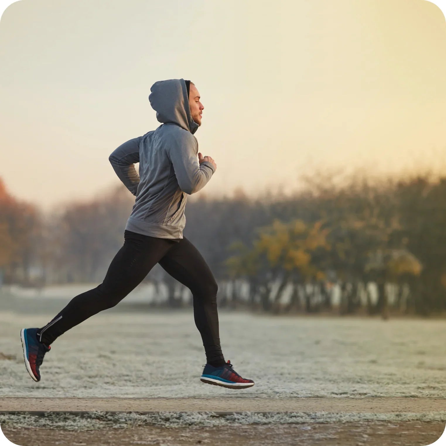 Man running outdoors in cold weather, athletic hydration and electrolyte balance concept