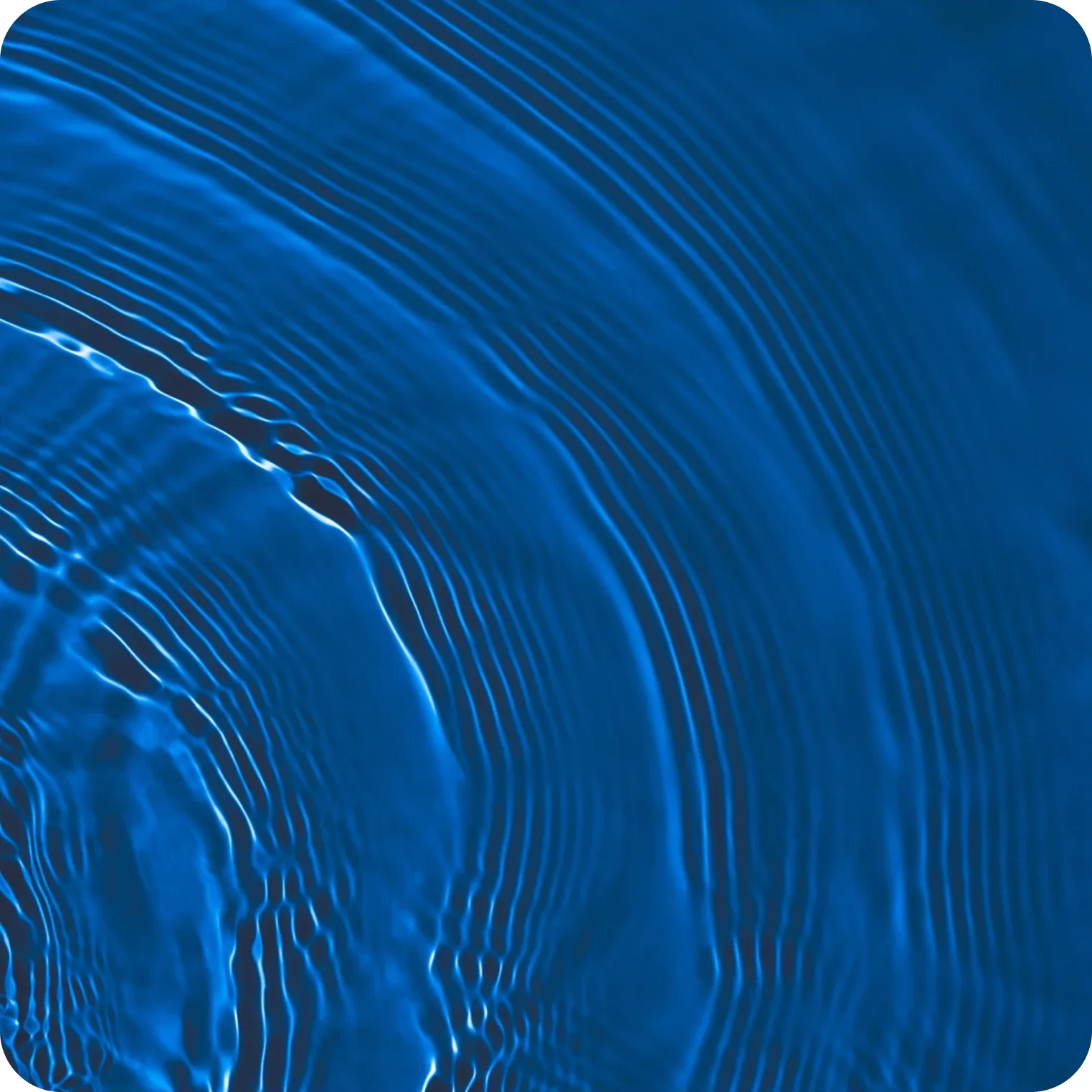 Abstract close-up of blue water ripples and waves, symbolizing hydration and electrolytes