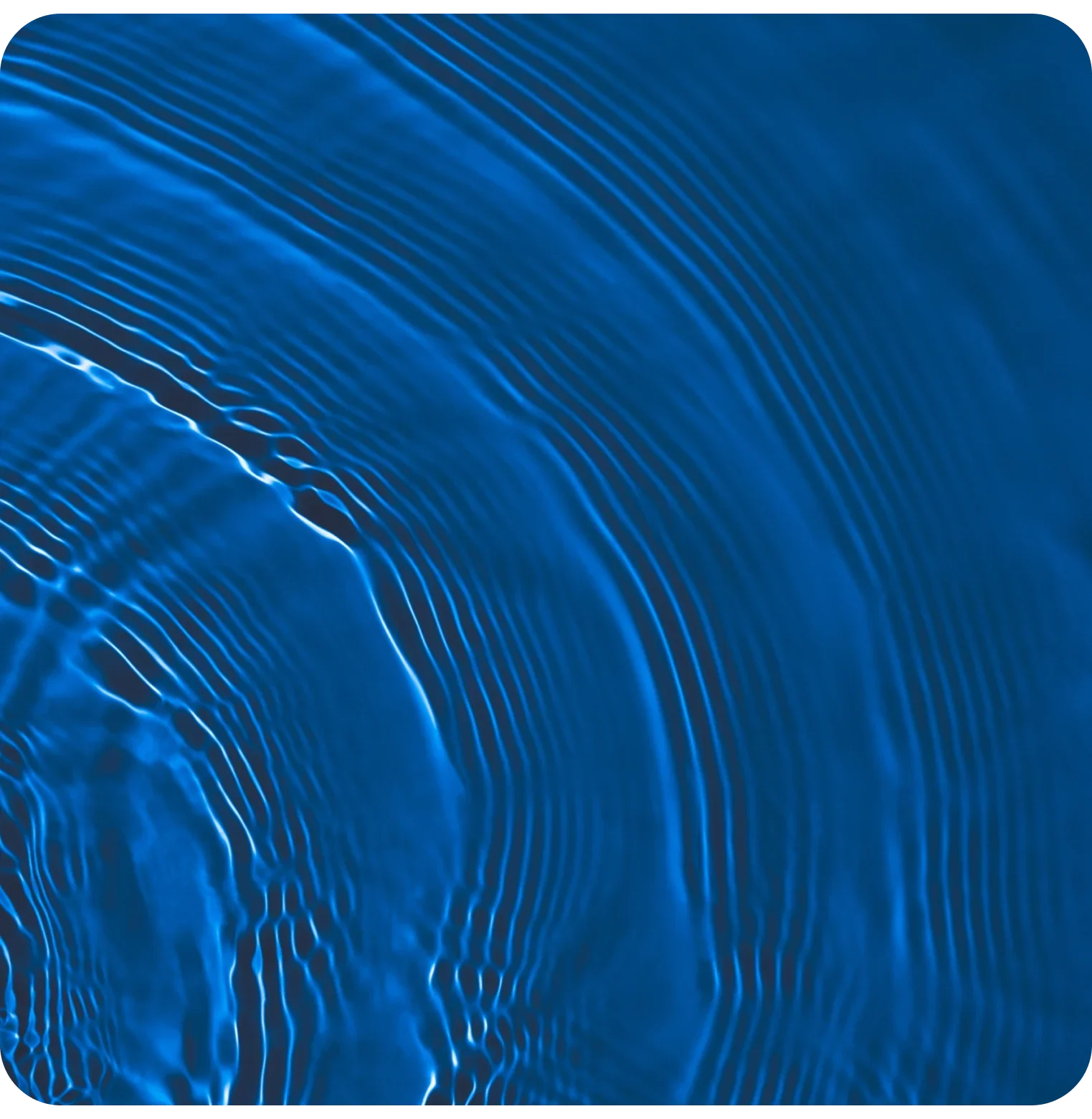 Abstract close-up of blue water ripples and waves, symbolizing hydration and electrolytes