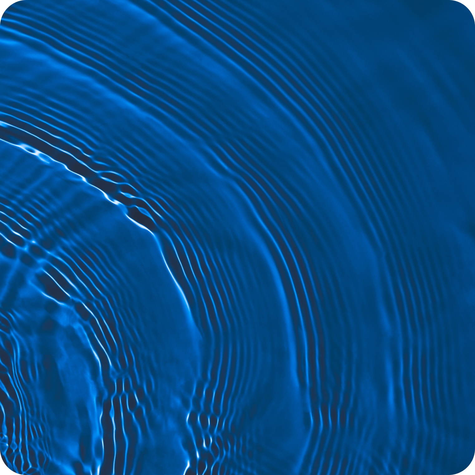 Abstract close-up of blue water ripples and waves, symbolizing hydration and electrolytes