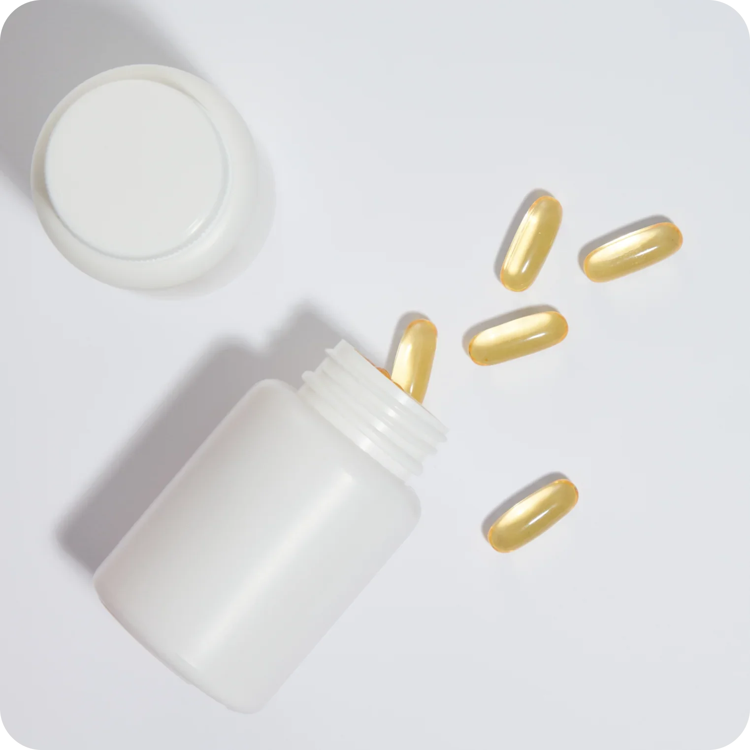 Open white bottle with clear yellow capsules for natural electrolyte supplement