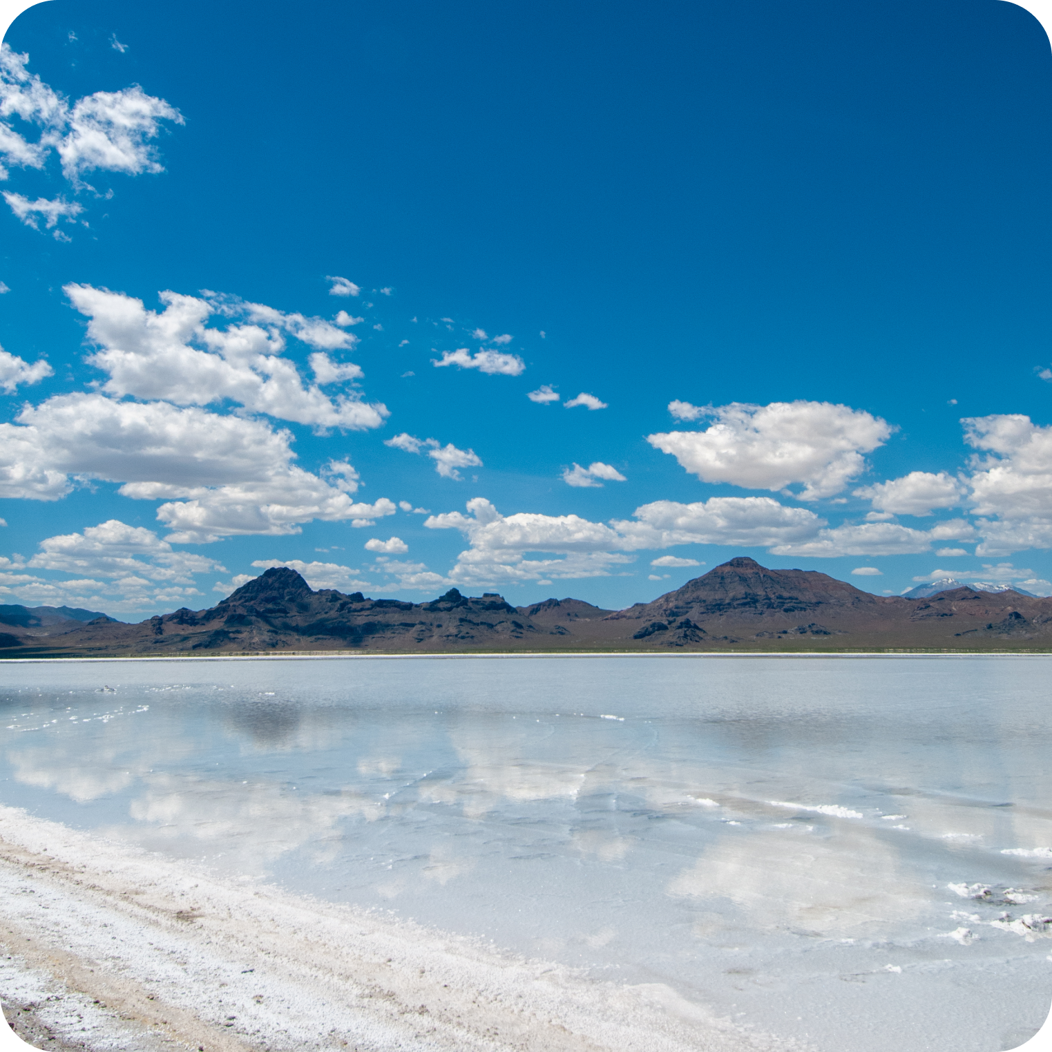 Natural salt flats with mountains and blue sky, source of natural electrolytes